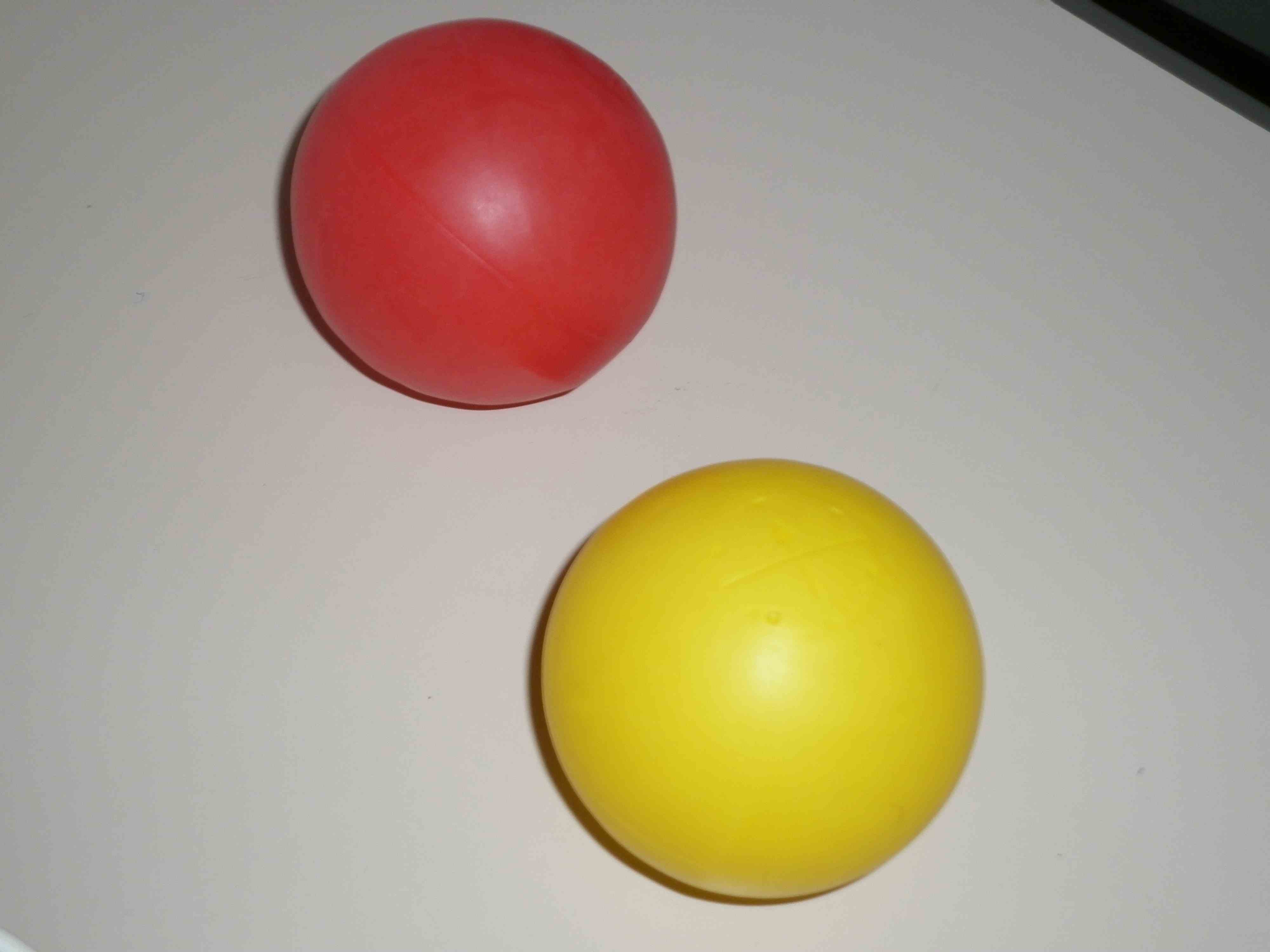 Red plastic ball, yellow plastic ball